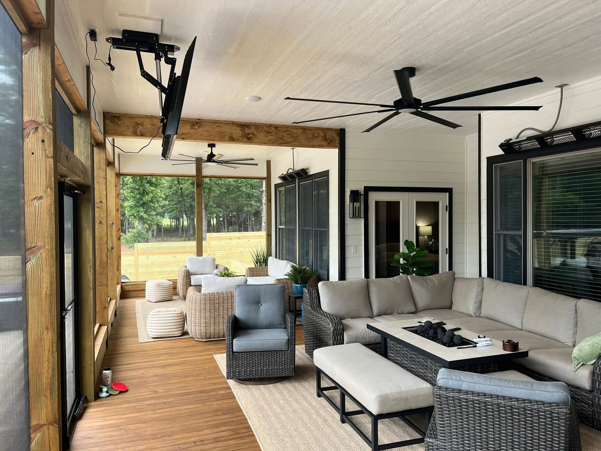 Covered outdoor living porch with fireplace built by Mayfield Construction
