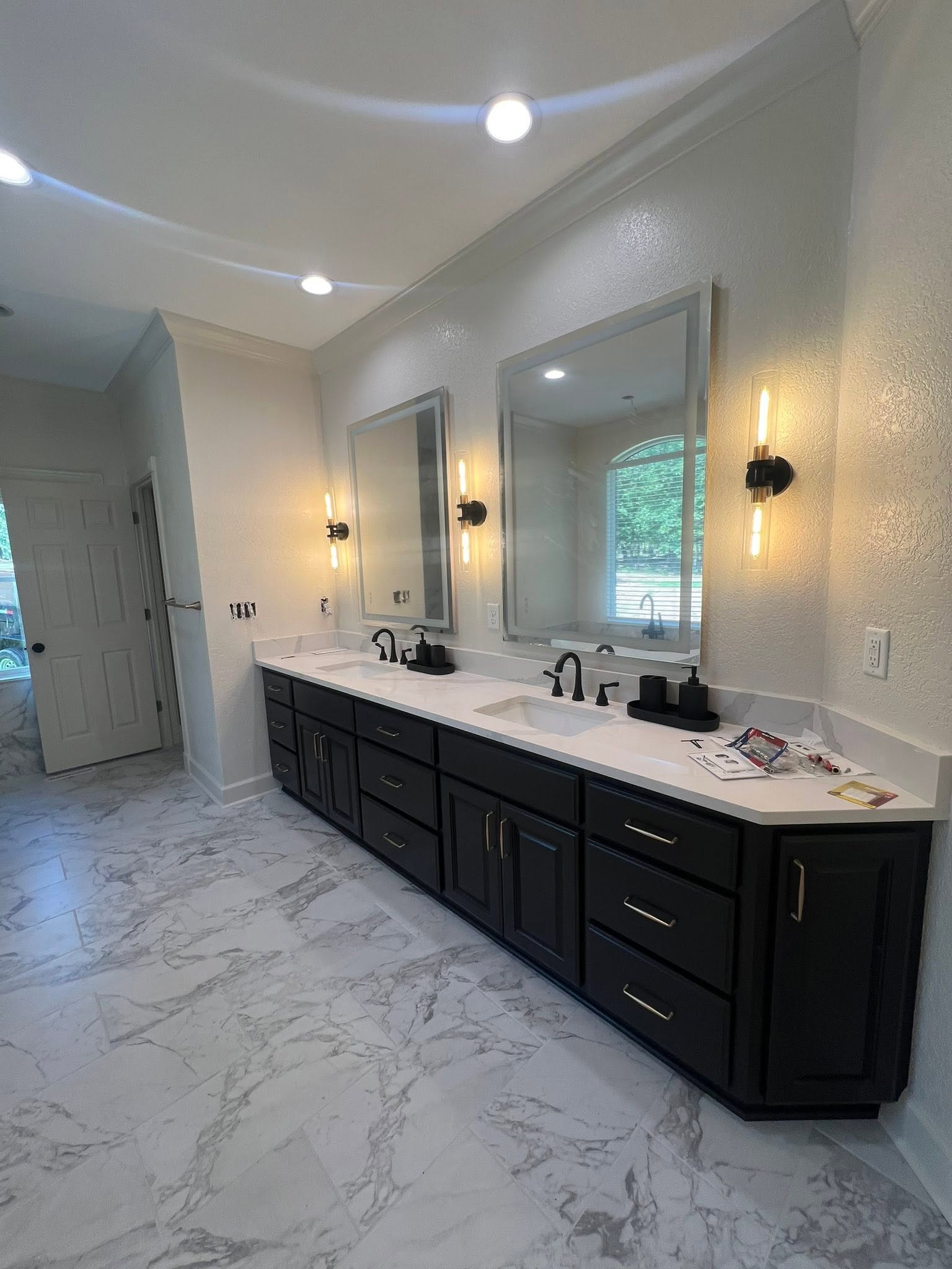 Finished bathroom and closet remodel by Mayfield Construction